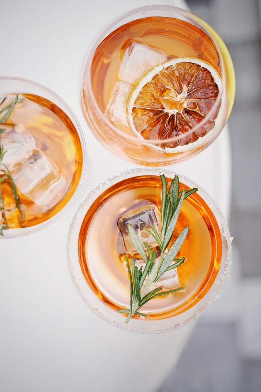 sliced orange fruit in clear drinking glass