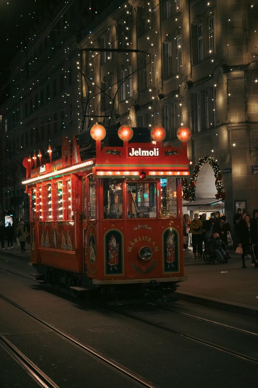 festively decorated tram on a winter night